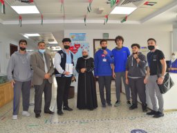 GR-12-Boys giving donation at Sharjah City for HumanitarianServices